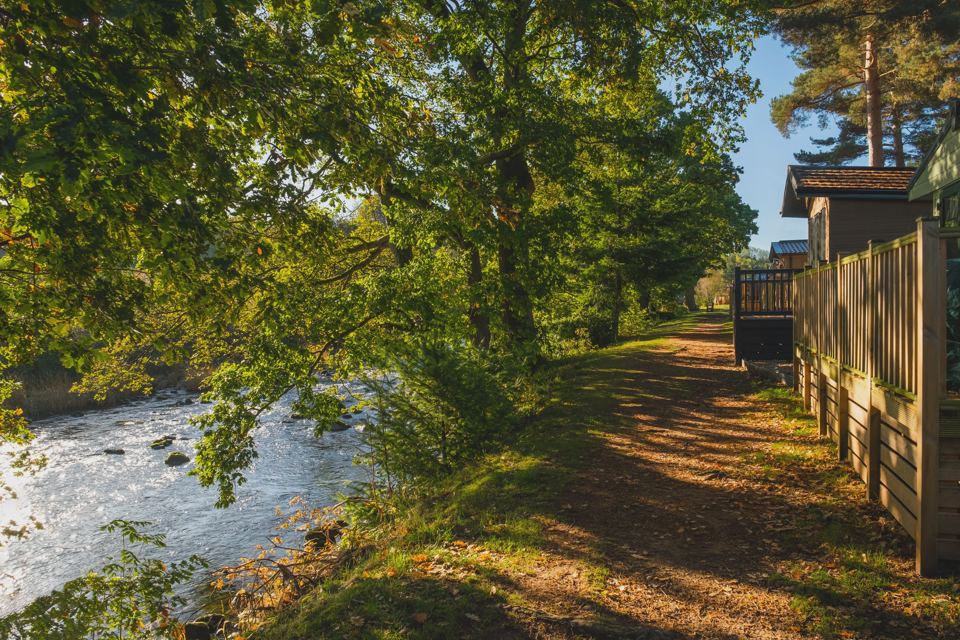 Lodges beside the riverside path