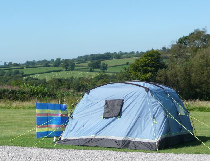 Tent pitch above the fields