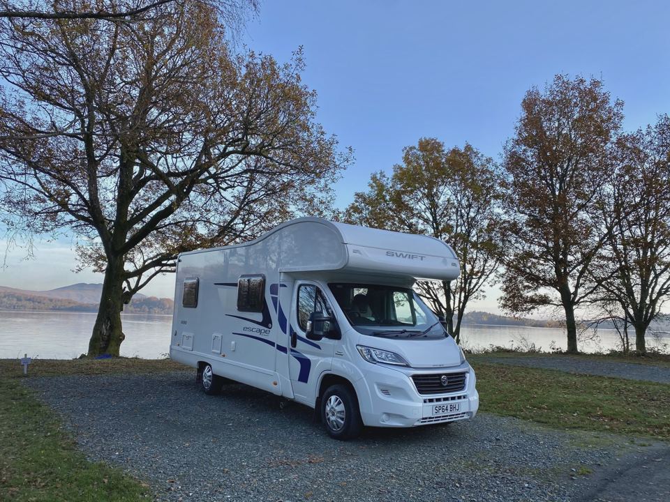 Motorhome on gravel by the water