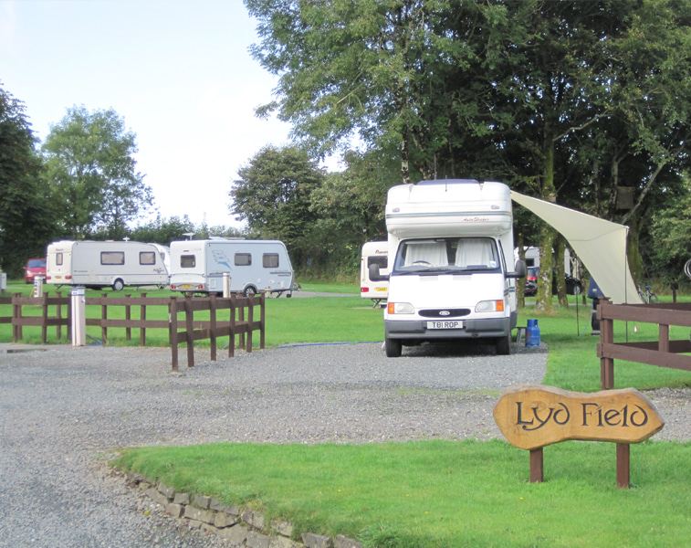 Motorhomes on the gravel by the sign