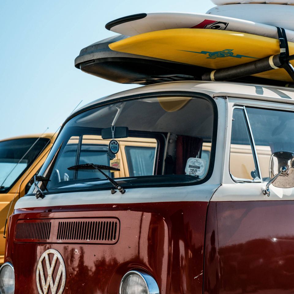 Campervan with surfboards on the roof