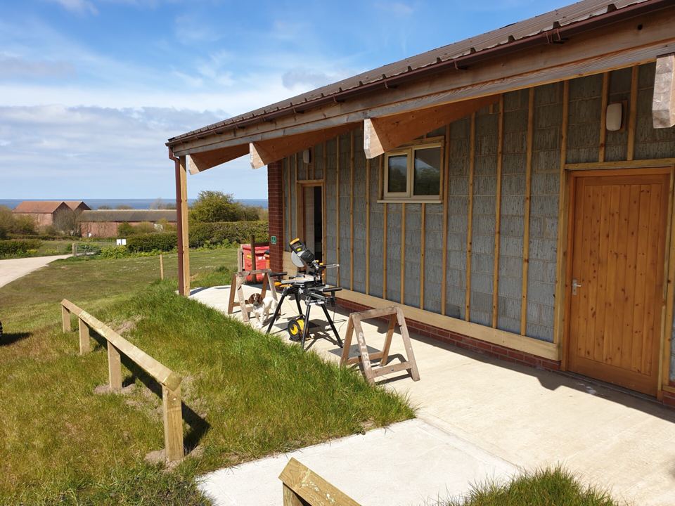 Amenity block with sea beyond
