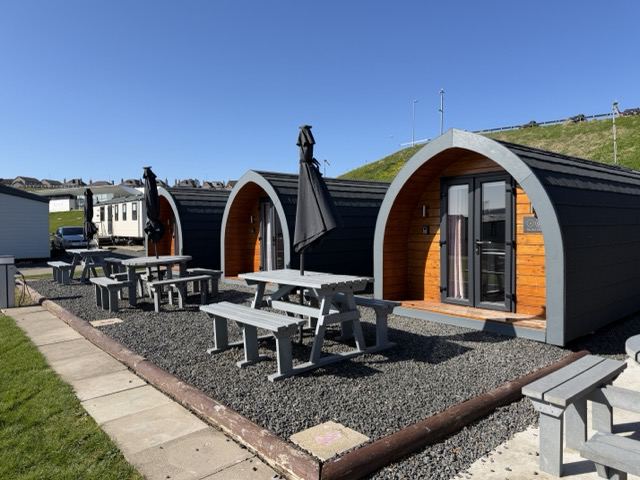 Glamping pods with picnic tables