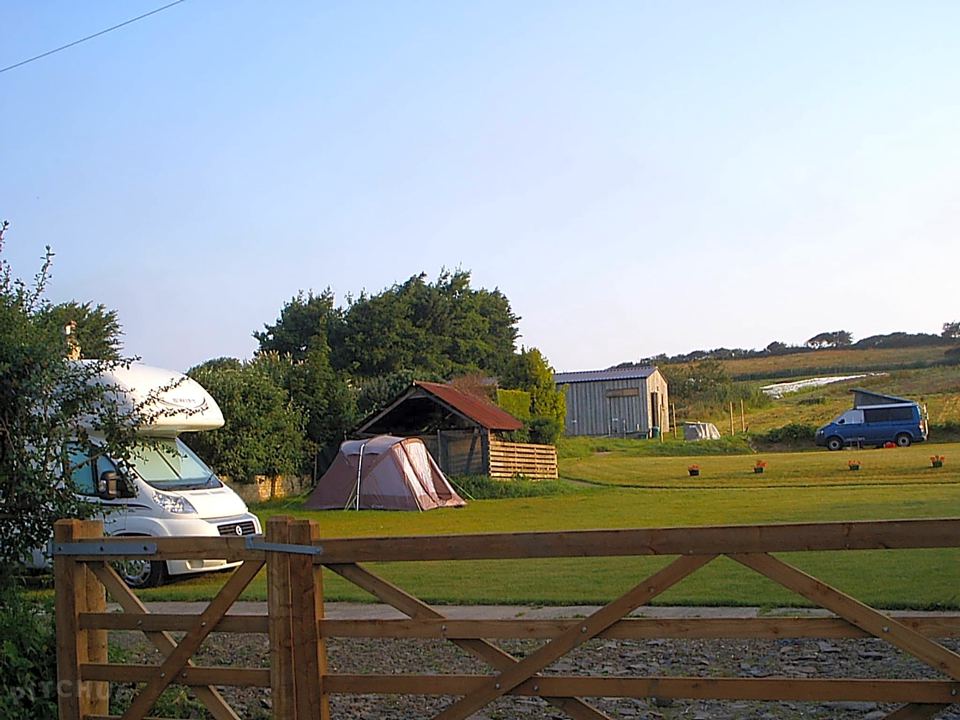 Campervan and tent on the grass