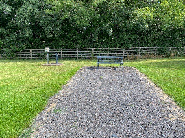 Gravel pitch beside the hedge