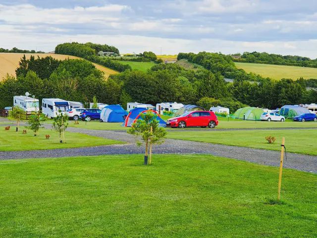 Tents and tourers on the grass