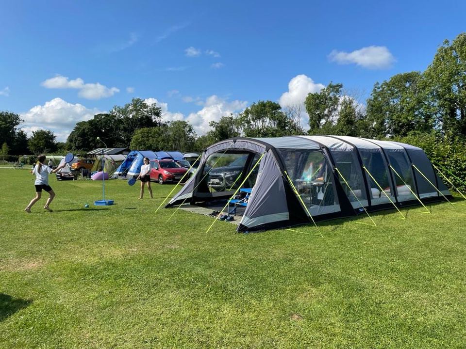 Large tent on the grass field