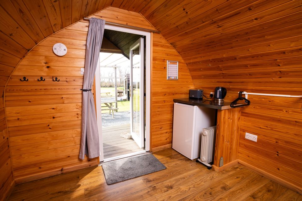 Pod interior with kettle and fridge