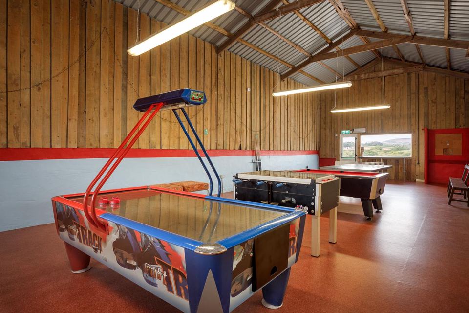Air hockey in the games barn