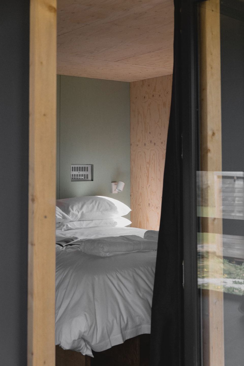 Bedroom glimpsed through a doorway