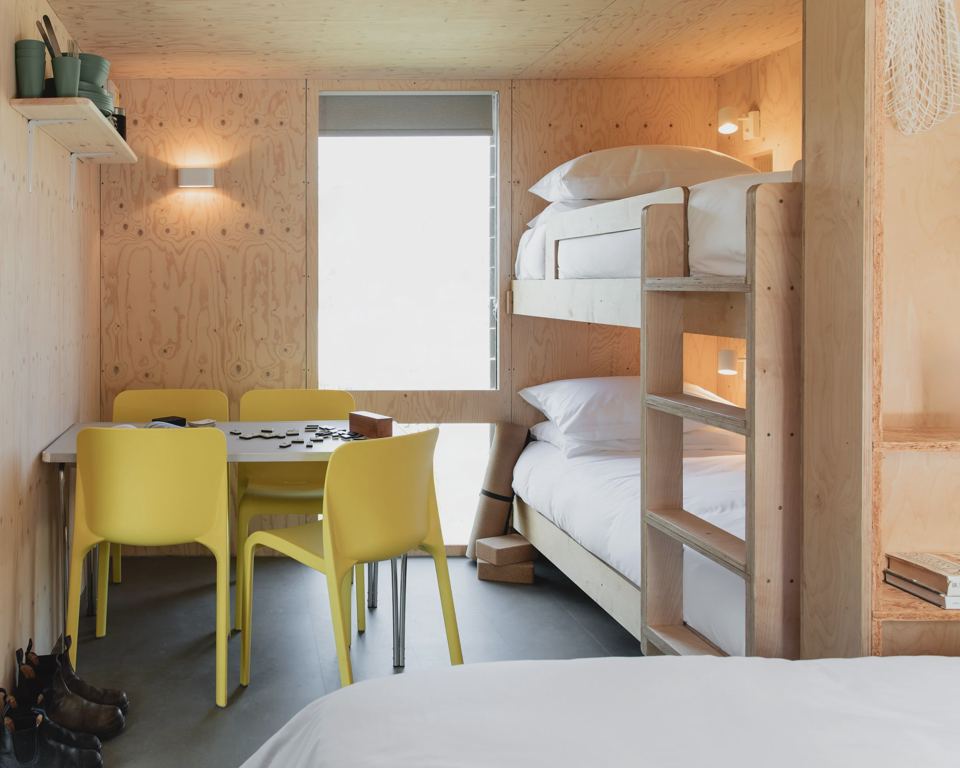 Bunk room with yellow chairs
