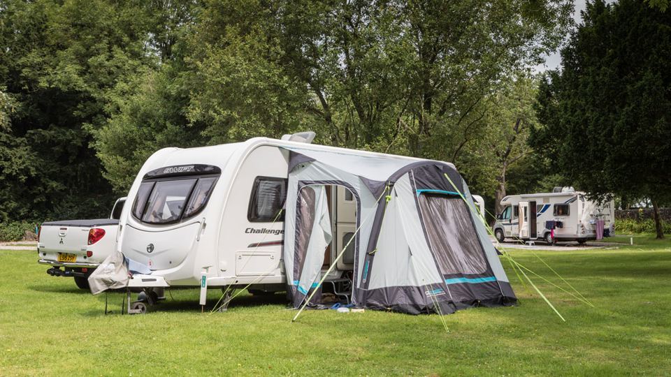 Caravan with awning on the grass