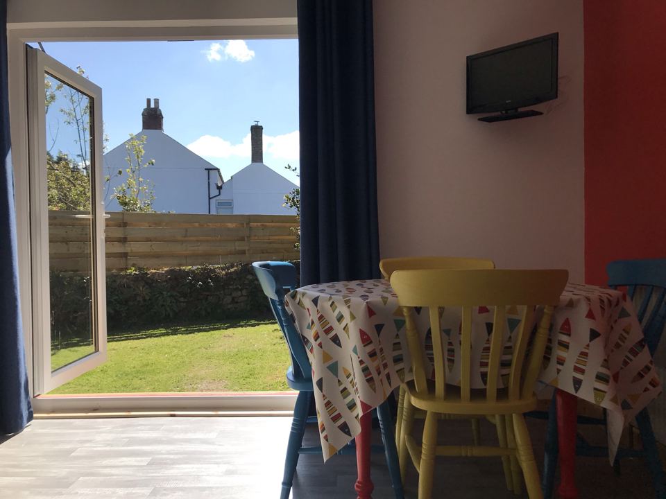 Dining table by the garden doors