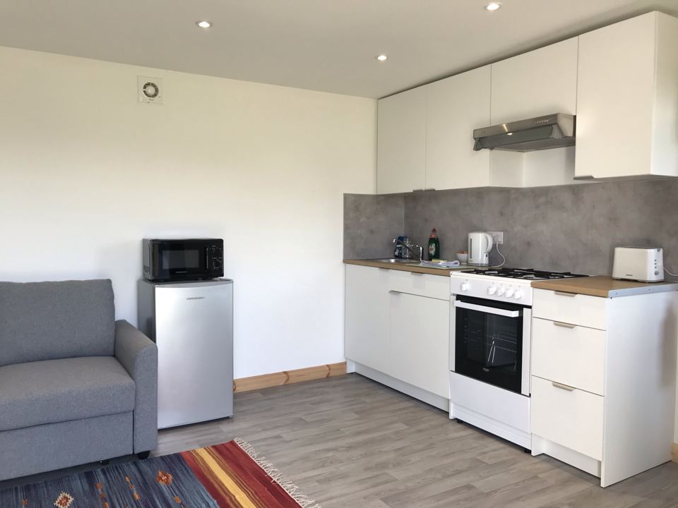 Compact kitchen with white units