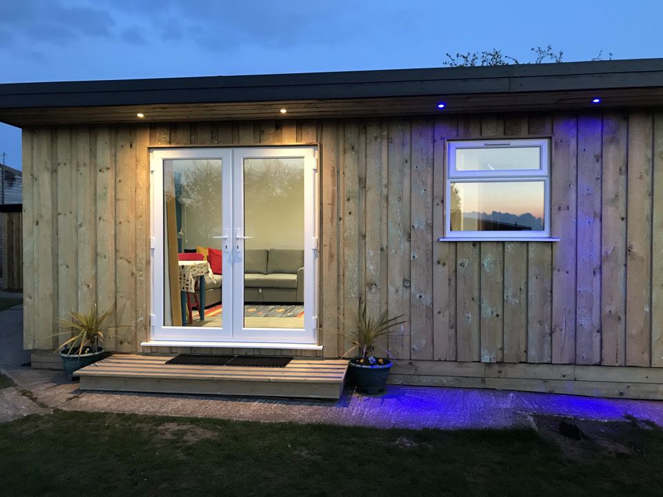 Wooden lodge exterior at dusk