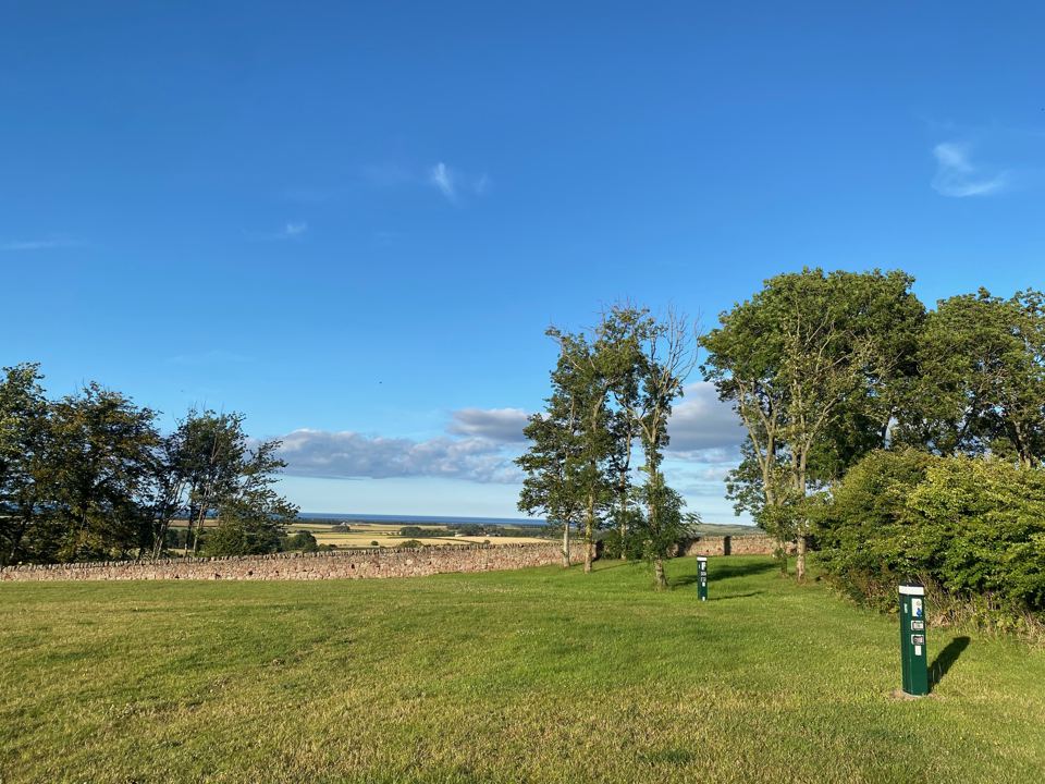 Grass pitches looking over the coast