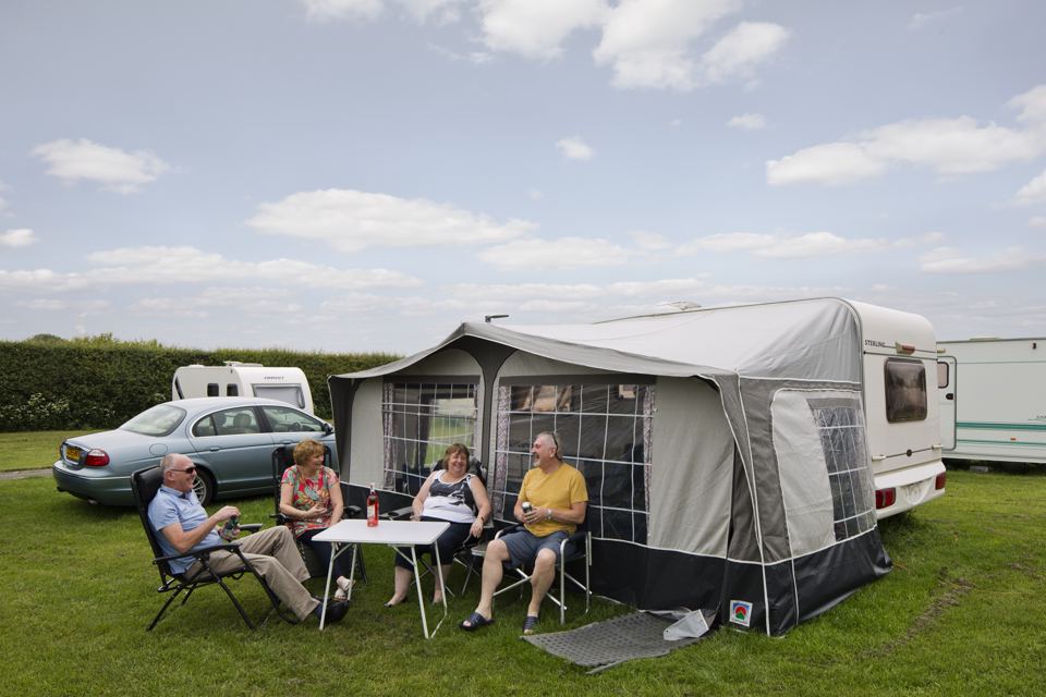 Caravan with awning on grass