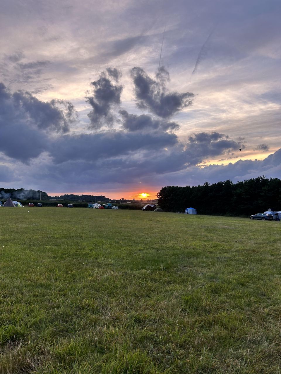Camping field at sunset
