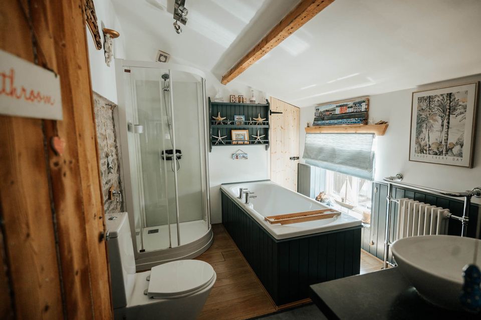 Bathroom with bath and shower