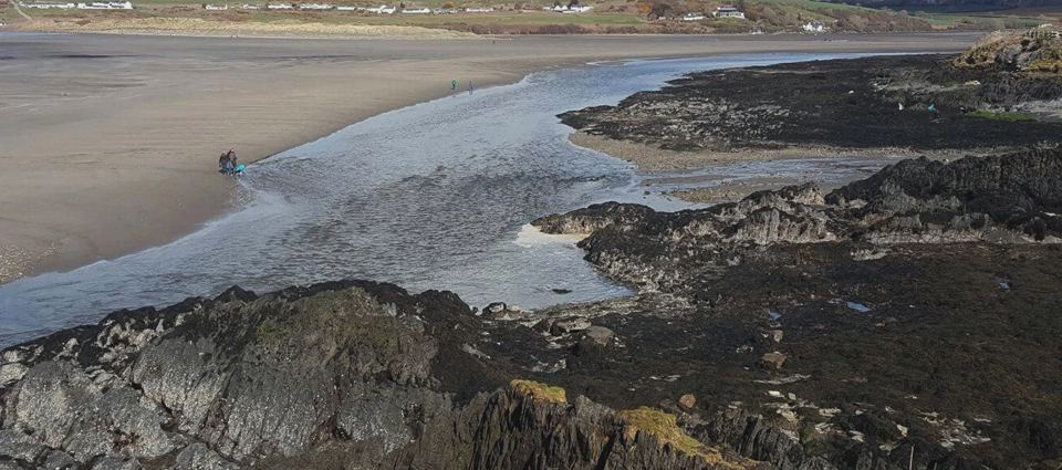 Rocky shore and sand at low tide