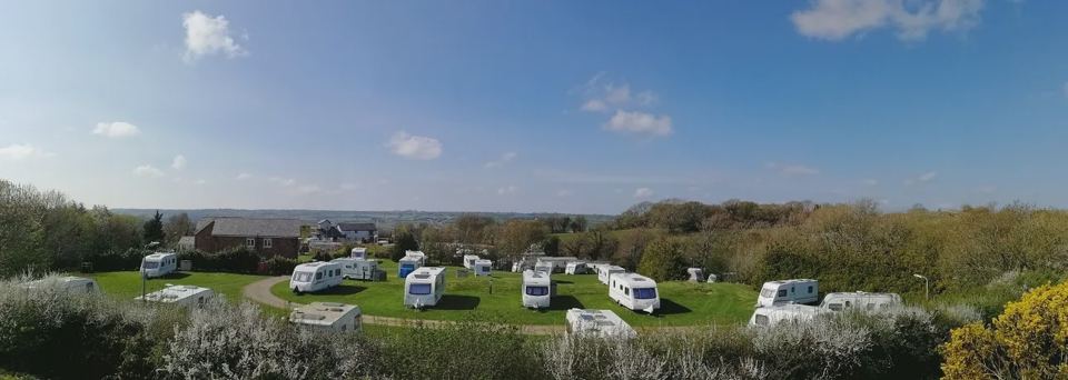 Touring caravans on the grass field