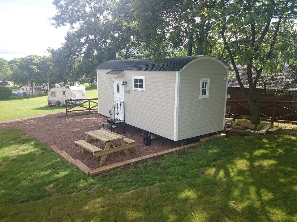 Shepherd's hut and picnic bench