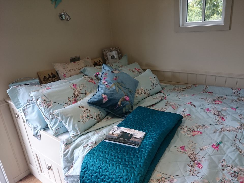 Bed inside a shepherd's hut