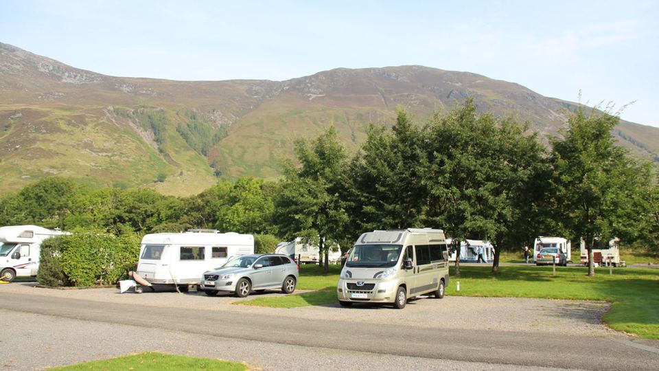 Caravans among trees