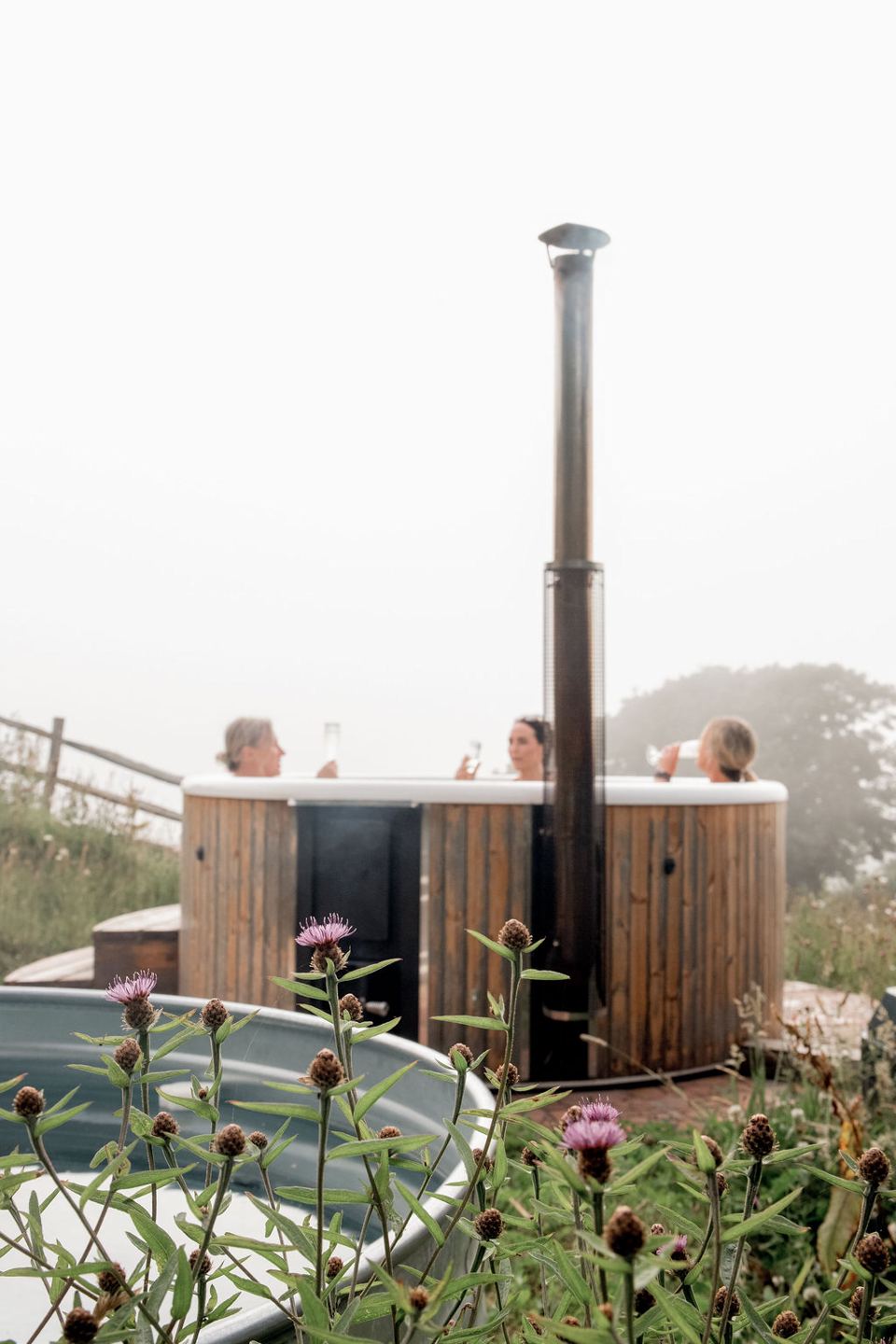 Wood-fired hot tub with flowers