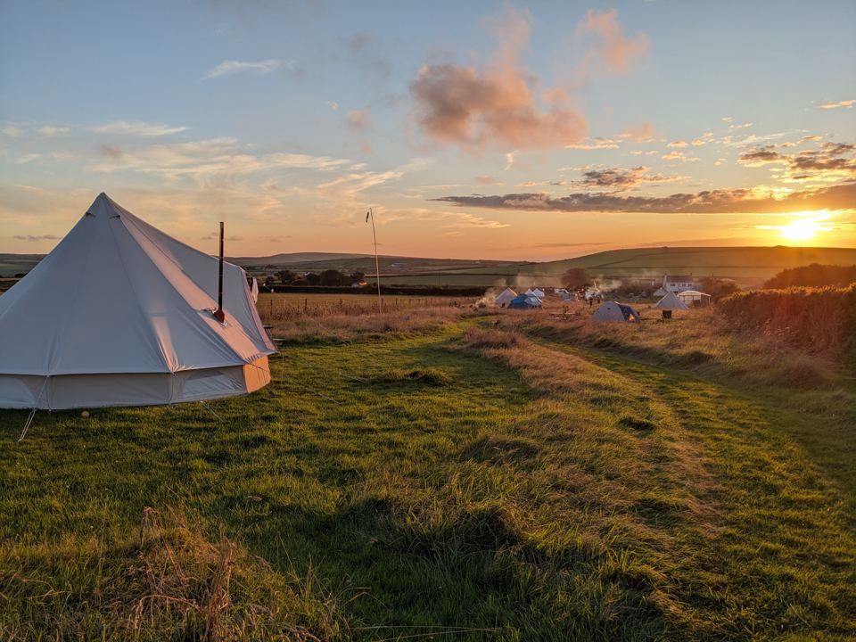 Bell tent at sunset over the meadow