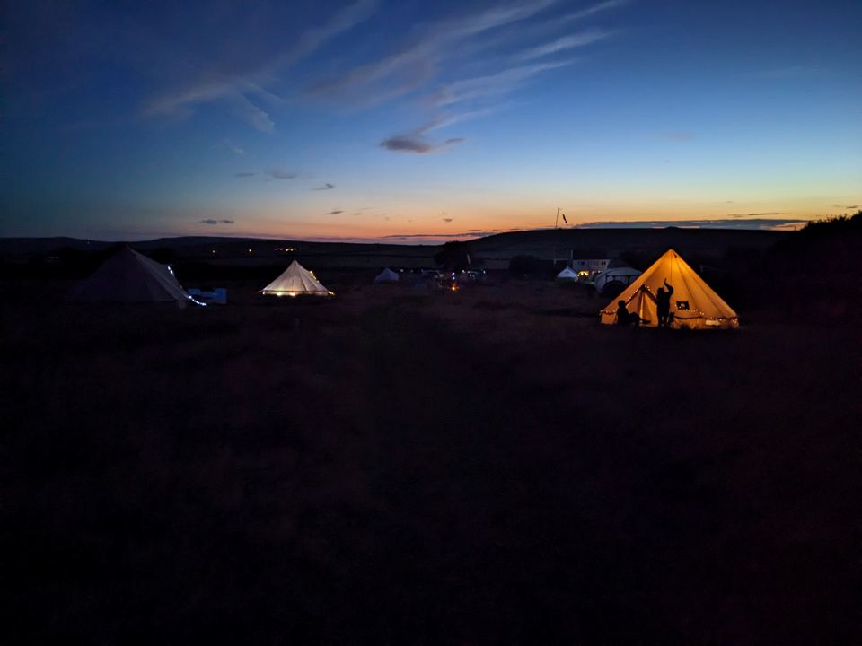 Bell tents after sunset