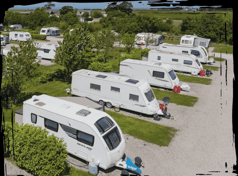 Row of tourers on hardstanding