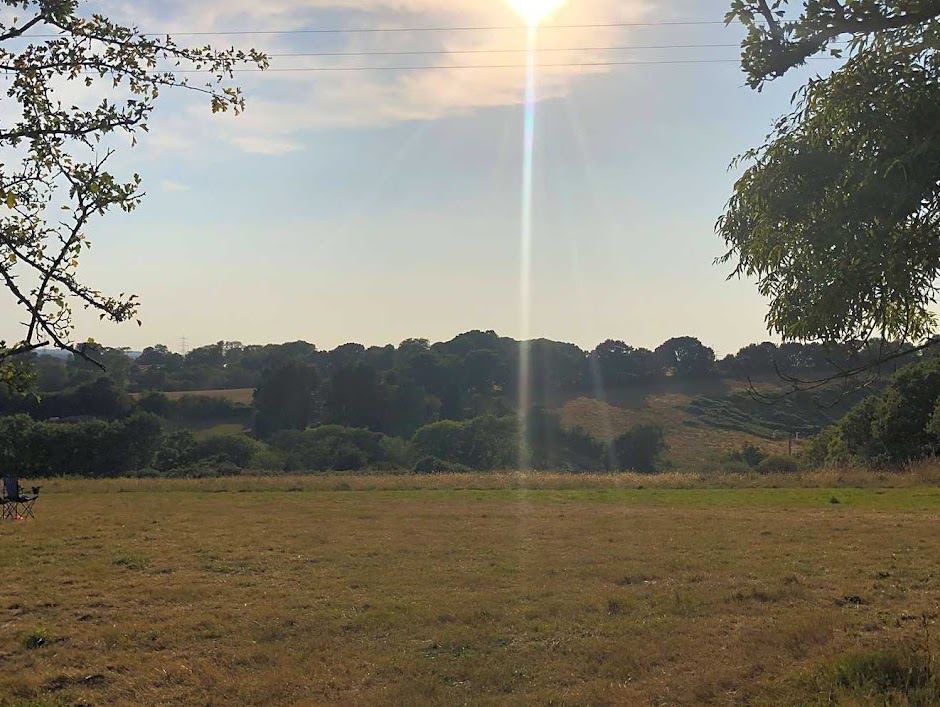 Open camping field and hills