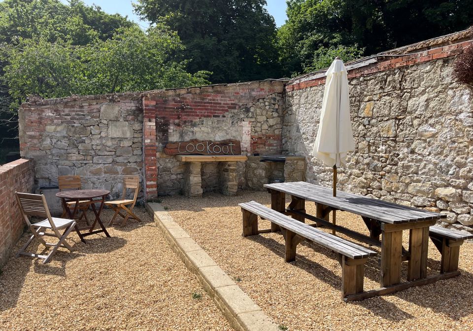 Walled courtyard with picnic tables