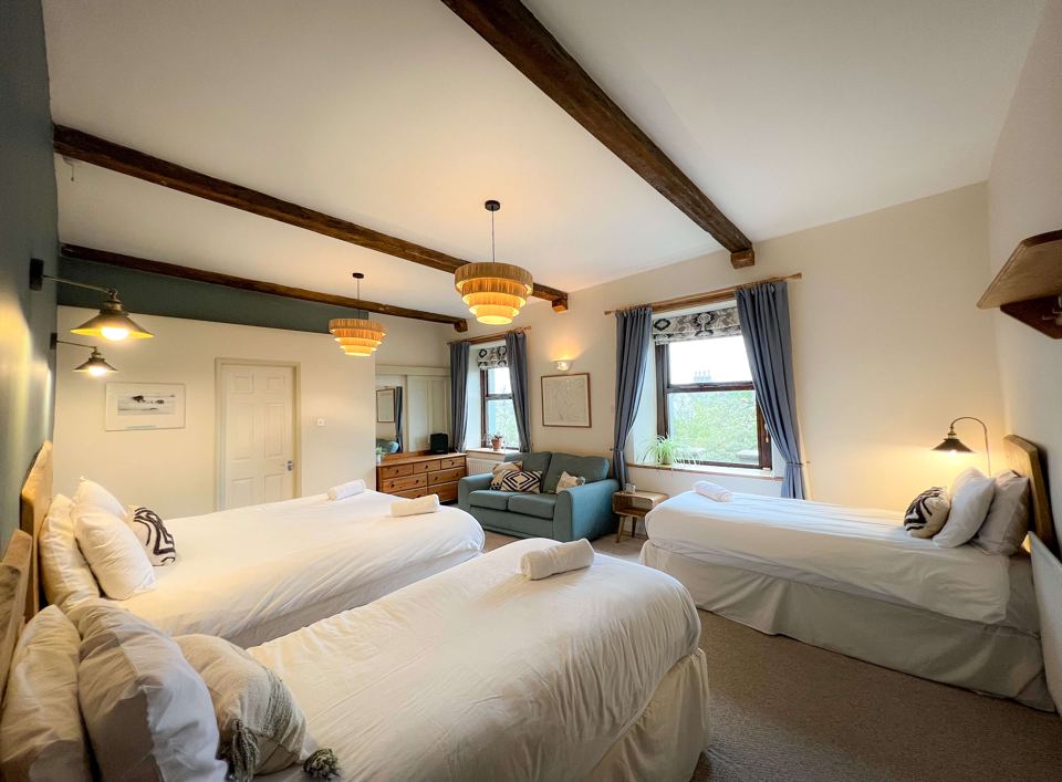Twin bedroom with wooden beams