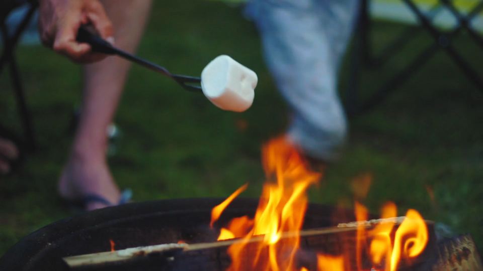 Toasting marshmallows on a fire pit