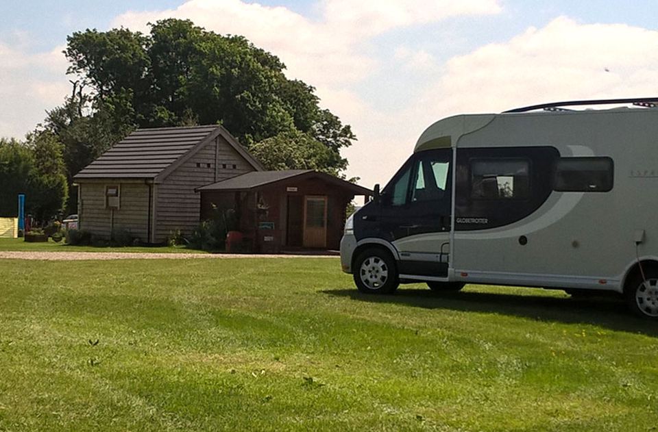 Motorhome beside the timber cabins
