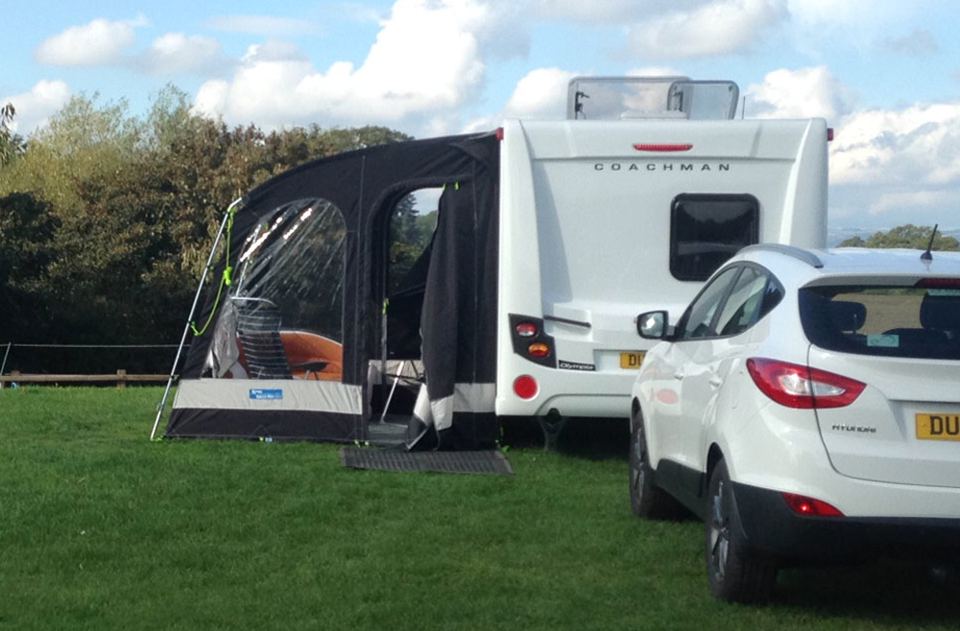 Caravan with awning on grass