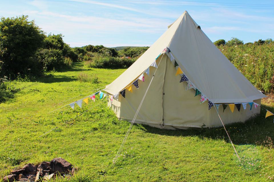 Bell tent in a grassy field