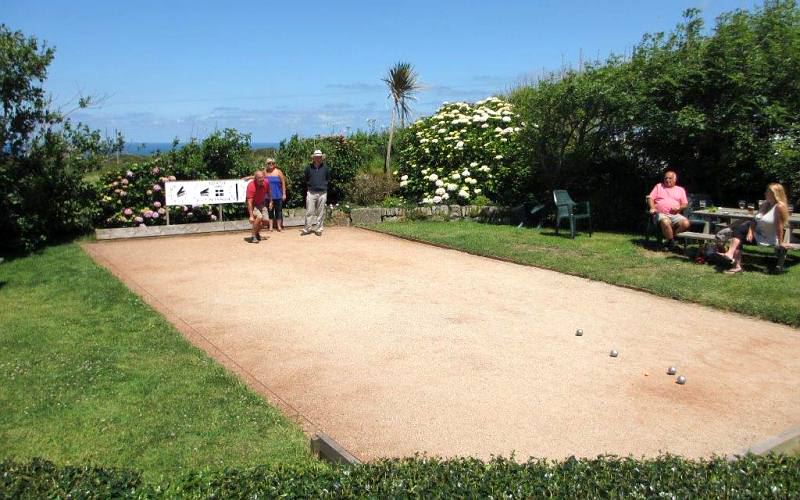Bowling green with people on the benches