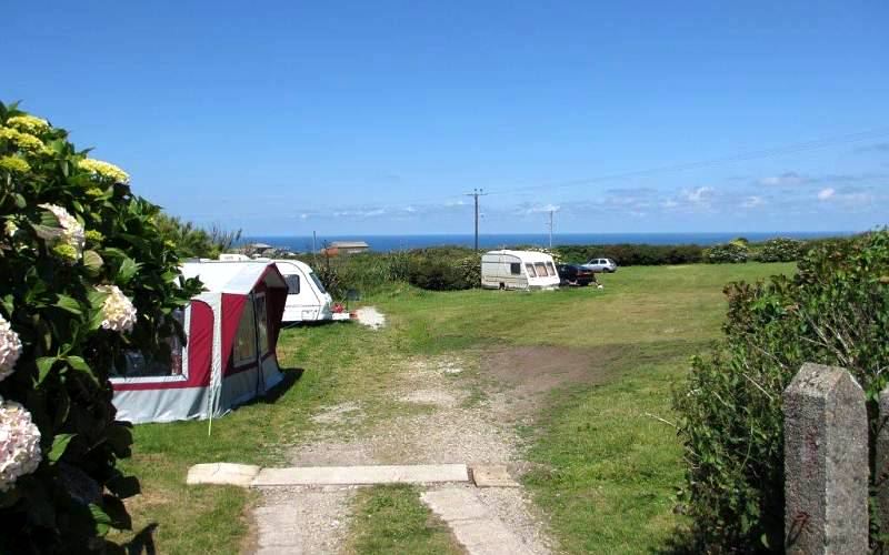 Tent pitch with the sea beyond