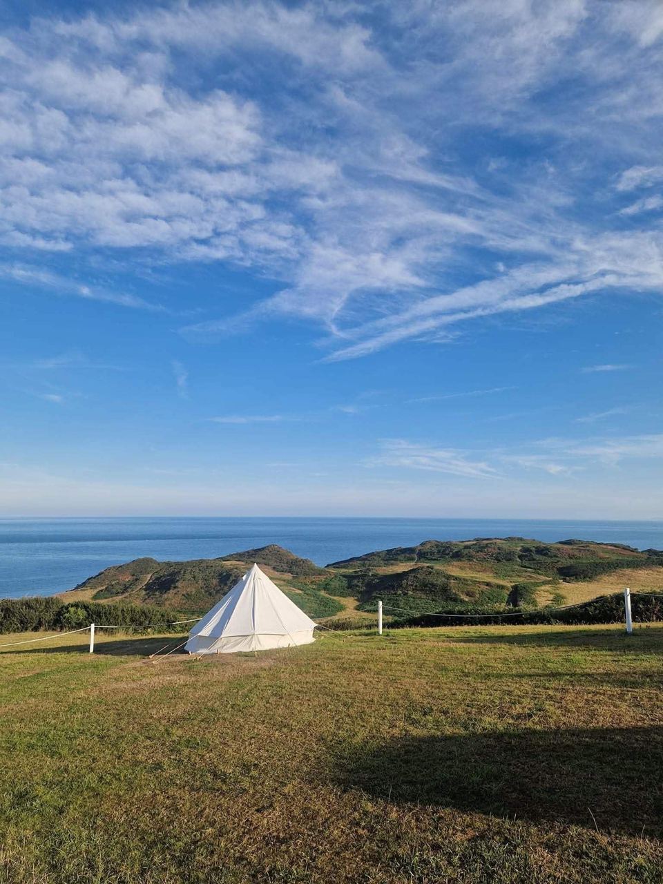 Bell tent with the sea beyond