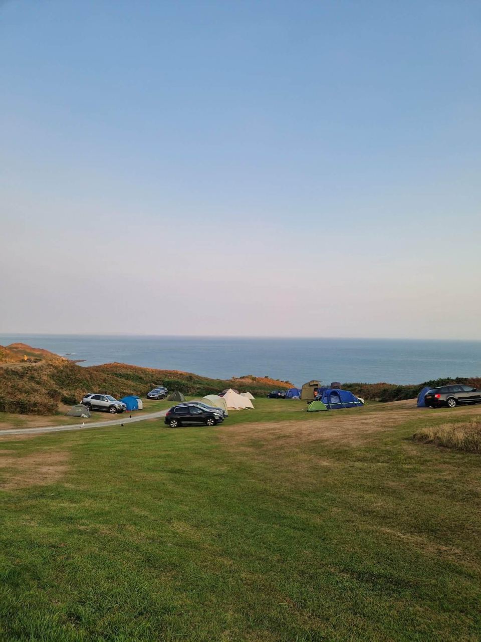 Pitches on the grass above the coast