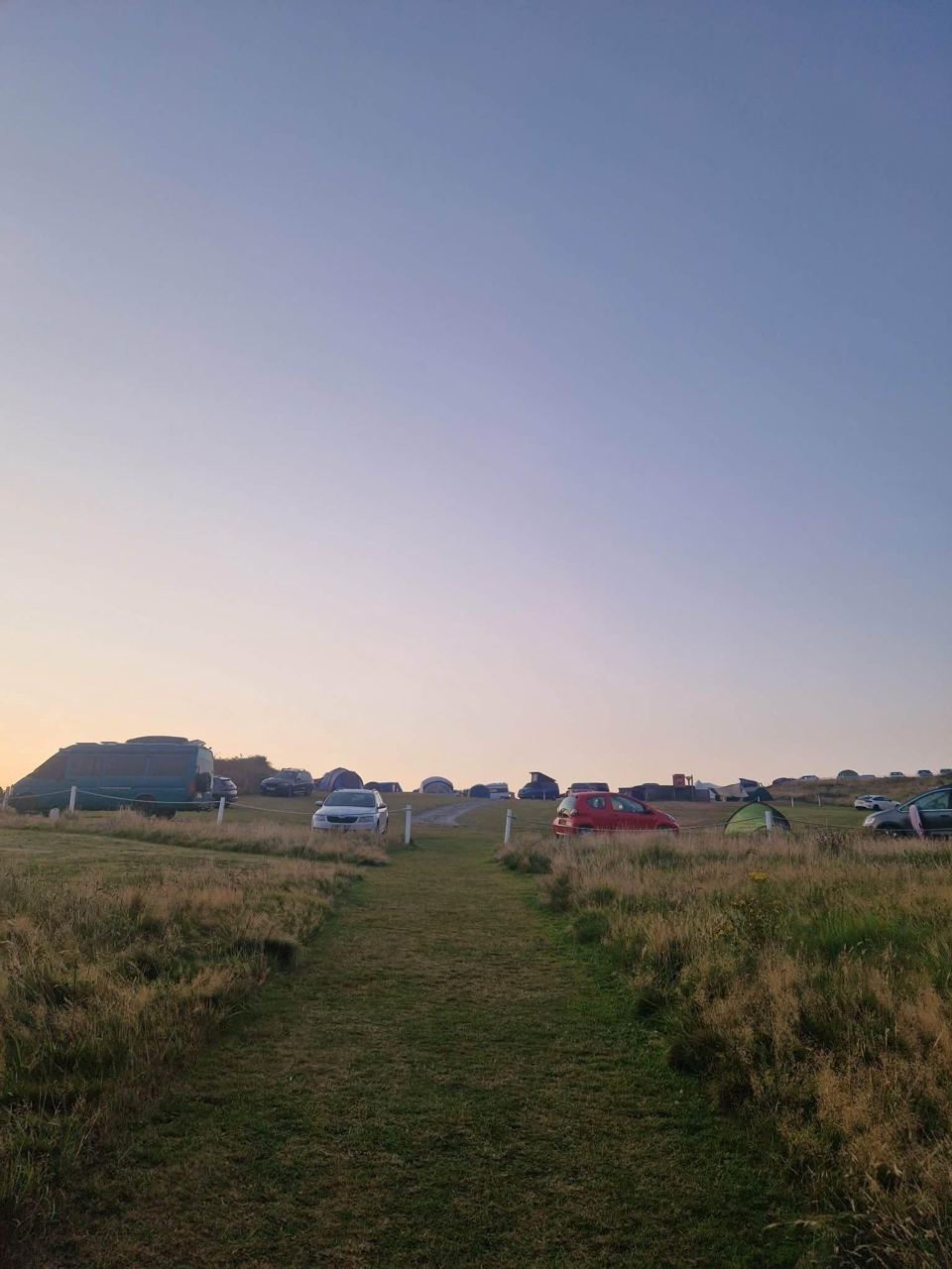 Pitches on the grass at dusk