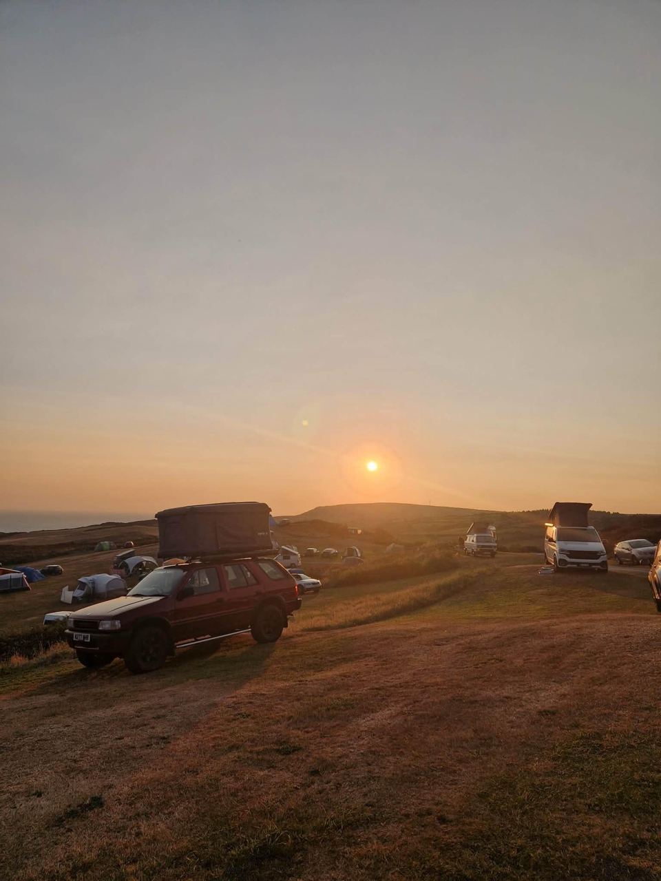 Cars and pitches at sunset