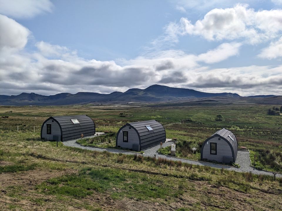 Row of pods facing the hills