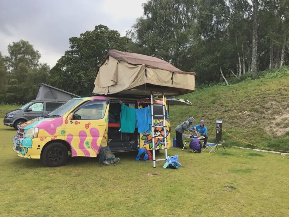 Camper with rooftop tent