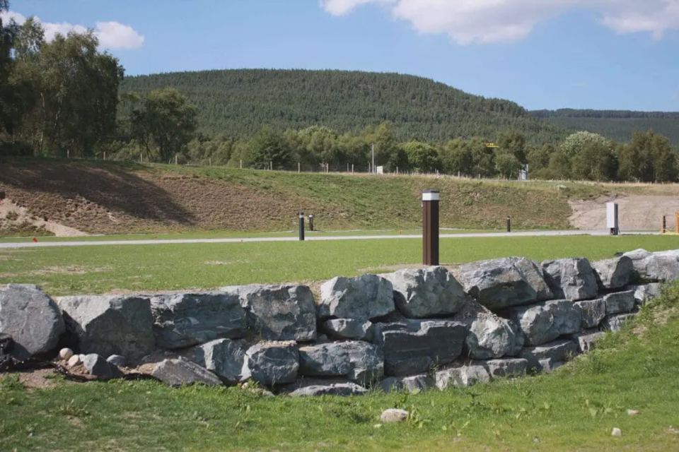 Grass pitches below the hillside