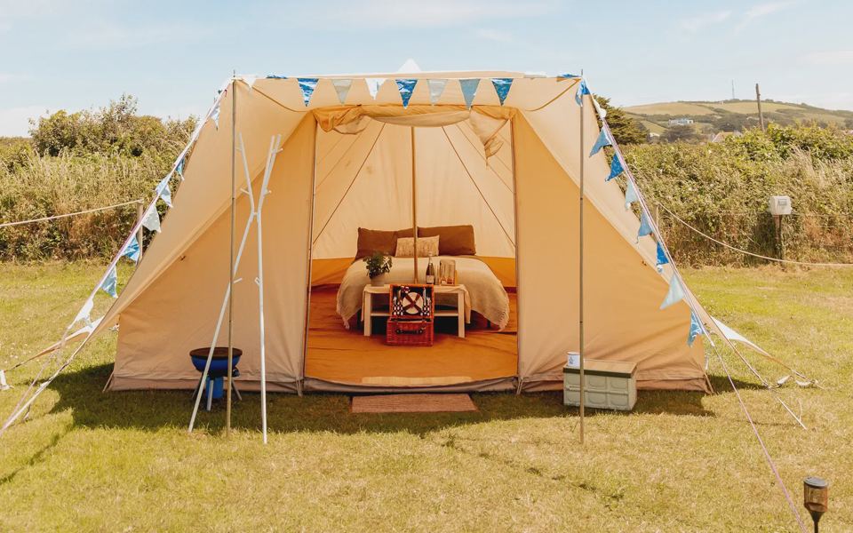 Bell tent with bunting on the grass