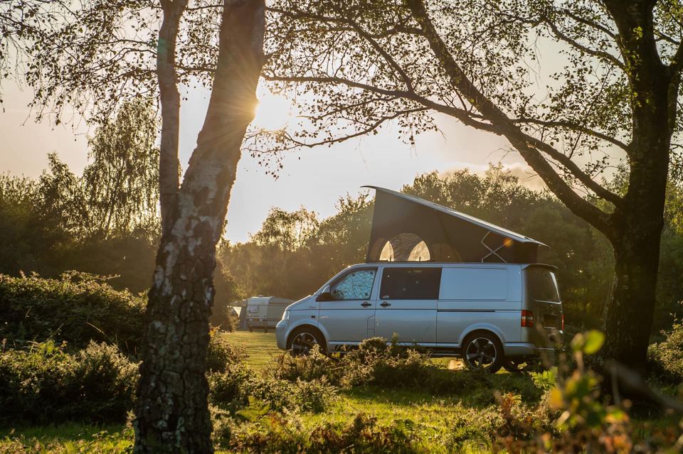 Campervan among the trees